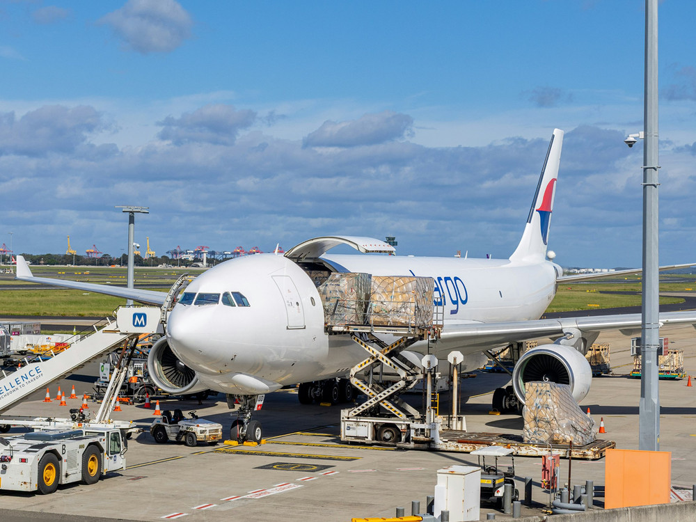Cargo aircraft being loaded with palletised freight